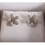 A pair of floral design diamond earrings, diamonds (26),