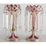 Pair of Venetian slice-cut lustres, on a pink ground, with droplets, 25cm high (one repaired).