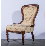 Victorian mahogany framed nursing chair, floral pattern upholstered back and seat, serpentine front,
