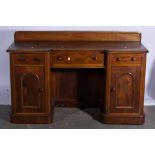 Victorian mahogany dressing table, with cupboards to each pedestal.