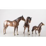 Beswick, four bay ponies, horses, one palomino pony, two dogs, three hounds, two foxes,