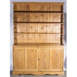 A pine dresser with open plate rack, cupboard base, 48cm wide,