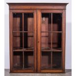 An Edwardian mahogany bookcase, two glazed doors, width 82cm.