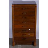 Mahogany eight drawer pedestal and music cabinet with drop fronts,