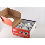 Two boxes of recycled golf balls