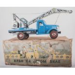 Russian made, tinplate crane in blue, boxed, 41cm long.