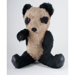 Plush panda bear with Thornes musical movement, 37cm tall, with other soft animals,