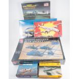 Four large boxes of aircraft model plastic kits, many still wrapped in plastic,