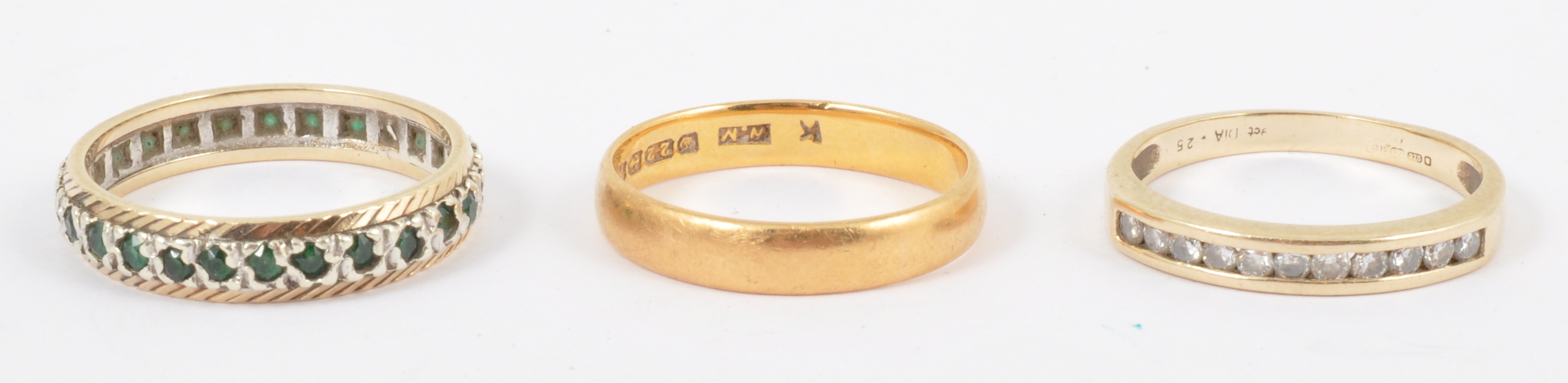 22ct gold band (2.6g), a wedding band, and a 9ct half eternity ring. (3).