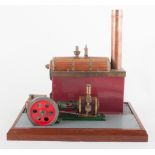 A model spirit fired beam engine, on a platform base.