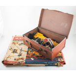 Meccano construction set, with loose selection of Meccano parts in small suitcase, plates, strips,