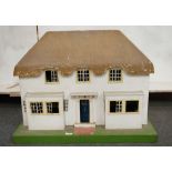 Triang 'Prince Elizabeth's Playhouse' doll's house, designed as a cottage, plinth base,