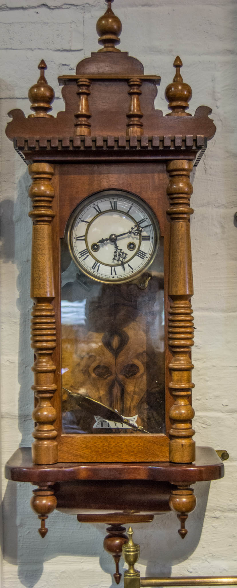 Wall clock, late 19th century movement, rehoused in a walnut case,