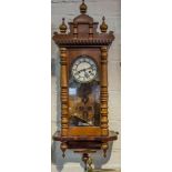Wall clock, late 19th century movement, rehoused in a walnut case,