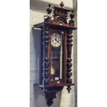 Wall clock by Anter, with key and pendulum 62cm.