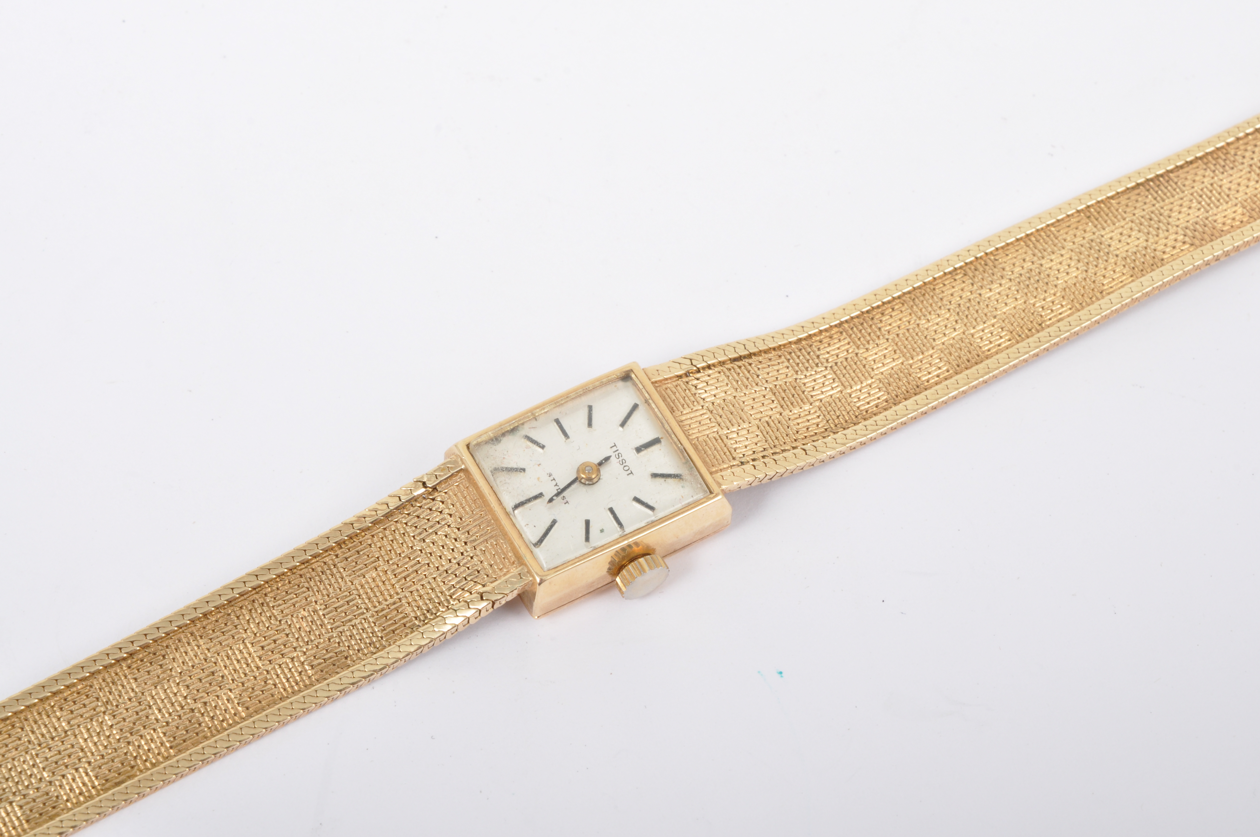 Lady's Tissot wristwatch, 9ct gold with integral bracelet strap.