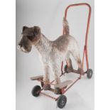 Triang hard dog walking toy, with frame and wheels.