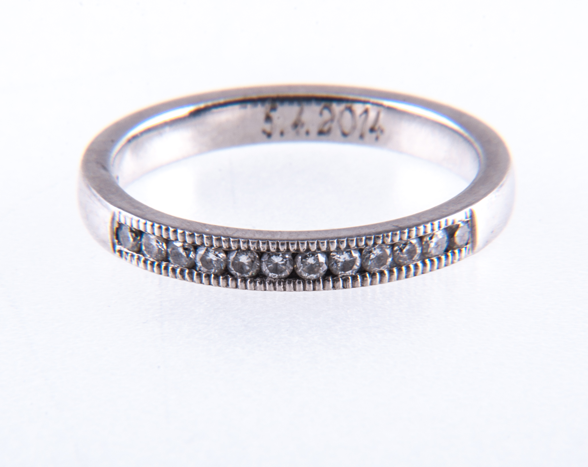 A diamond half eternity ring, twelve brilliant cut diamonds set into a 2.