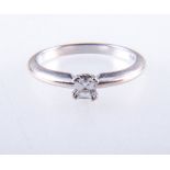 A diamond solitaire ring,