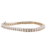 An all yellow metal diamond set tennis design bracelet, fifty nine diamonds, brilliant cut stones,