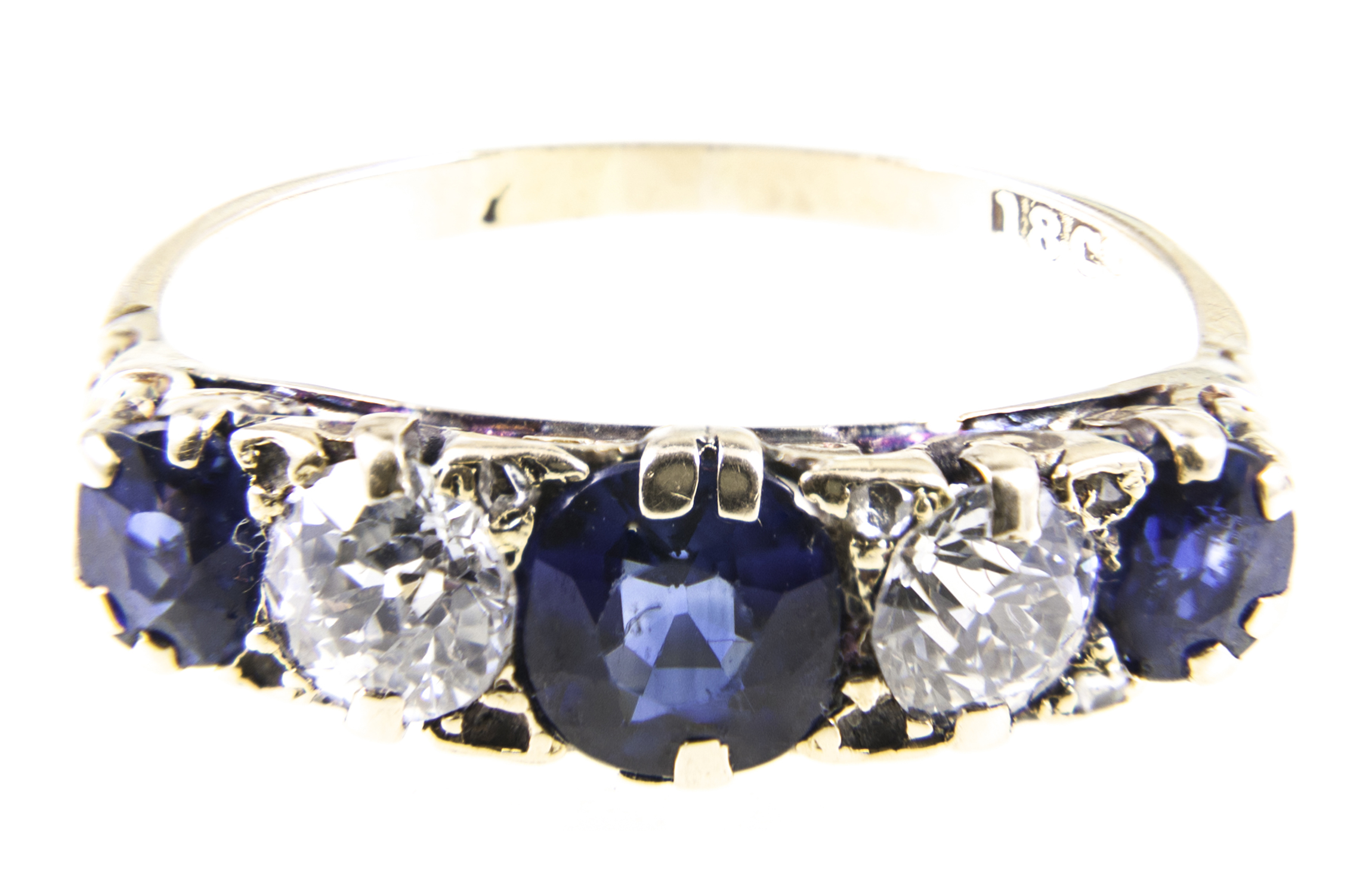 A sapphire and diamond half hoop ring, three mixed cut sapphires,