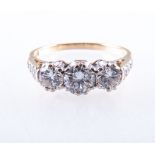 A diamond three stone ring, the brilliant cut stones slightly graduating in size,