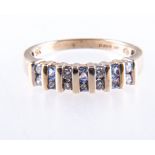 A pale tanzanite and diamond half hoop dress ring, six princess cut tanzanite,