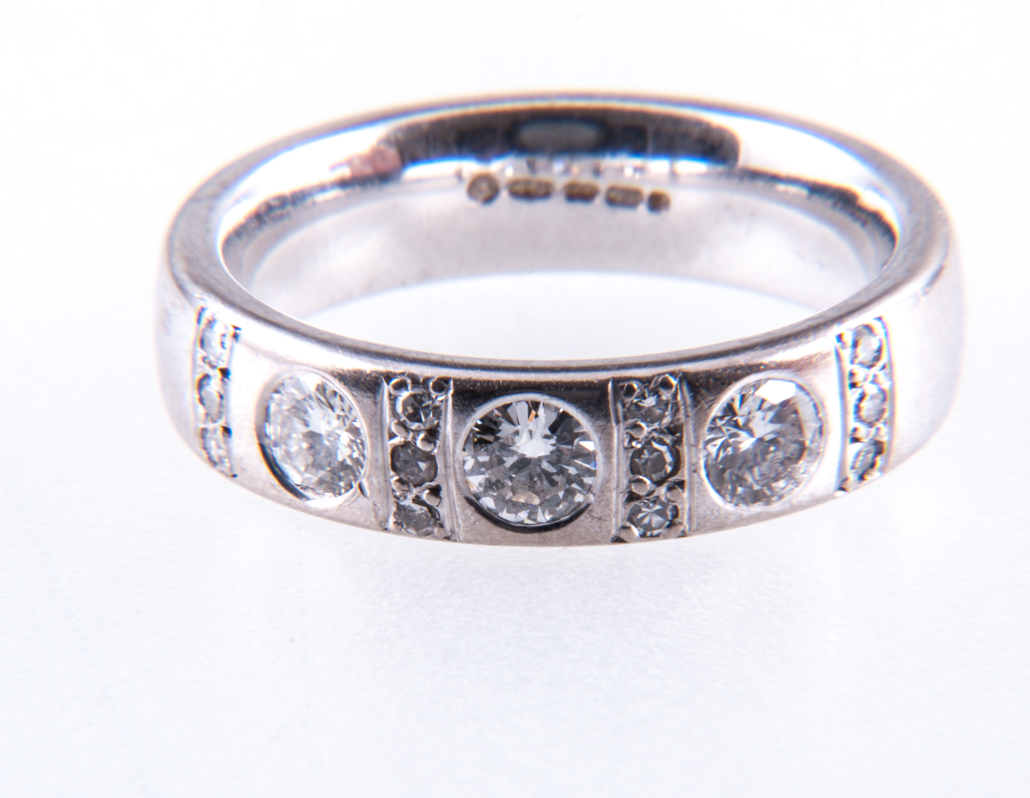 A diamond three stone half eternity ring,