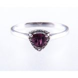 A pink rubelite and diamond cluster ring, one trillion cut rubelite, 4.