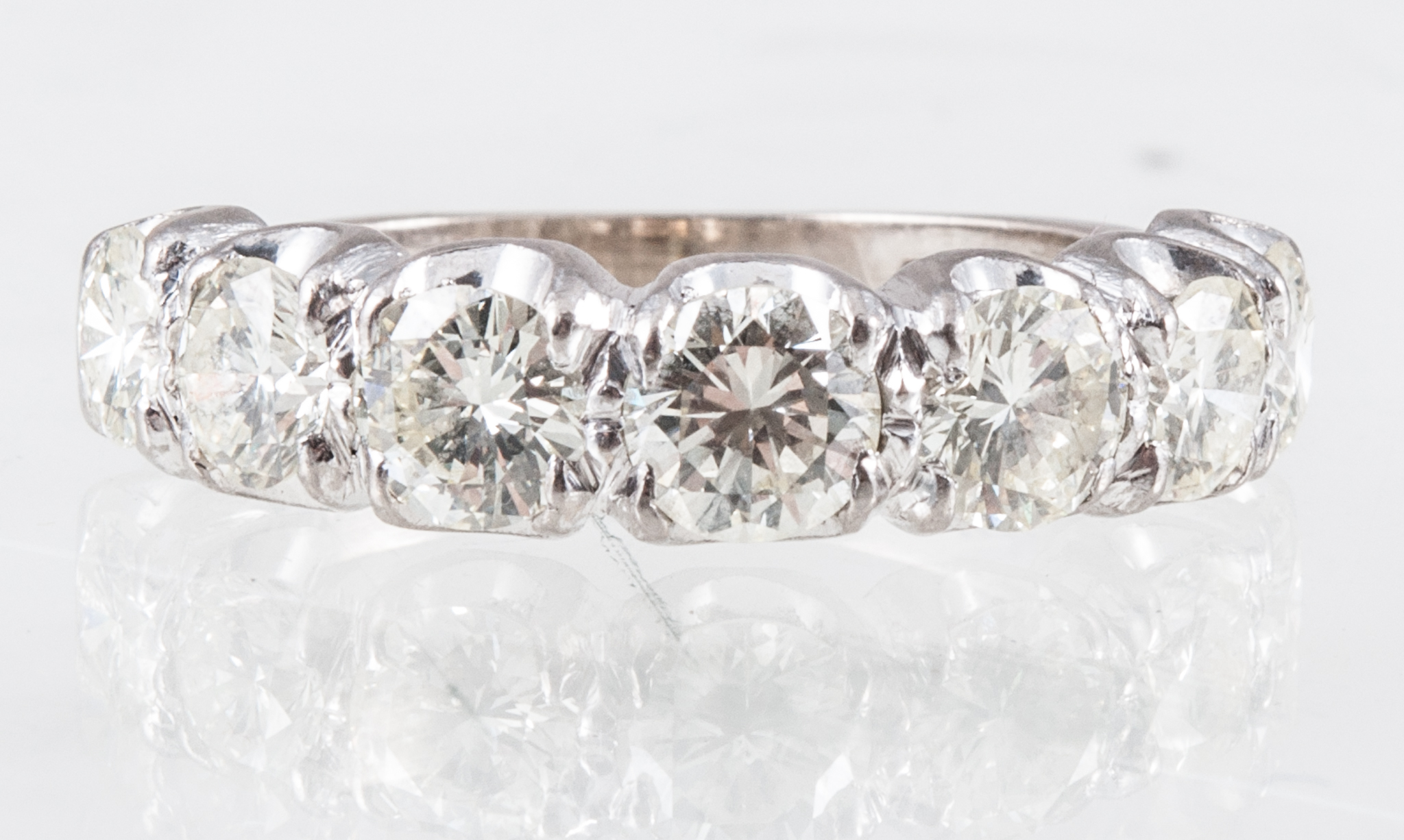 A diamond seven stone half eternity ring, the brilliant cut stones, slightly graduating in size,