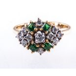 An emerald and diamond boat shape cluster ring, four square cut emeralds,