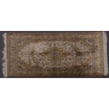 A Tabriz pattern silk rug, central medallion with floral tendrils, on an ivory coloured ground,