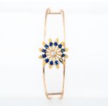 A diamond and blue enamel bangle,