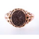 A 9 carat rose gold signet ring, the oval head engraved with three initials, 4mm wide shank,