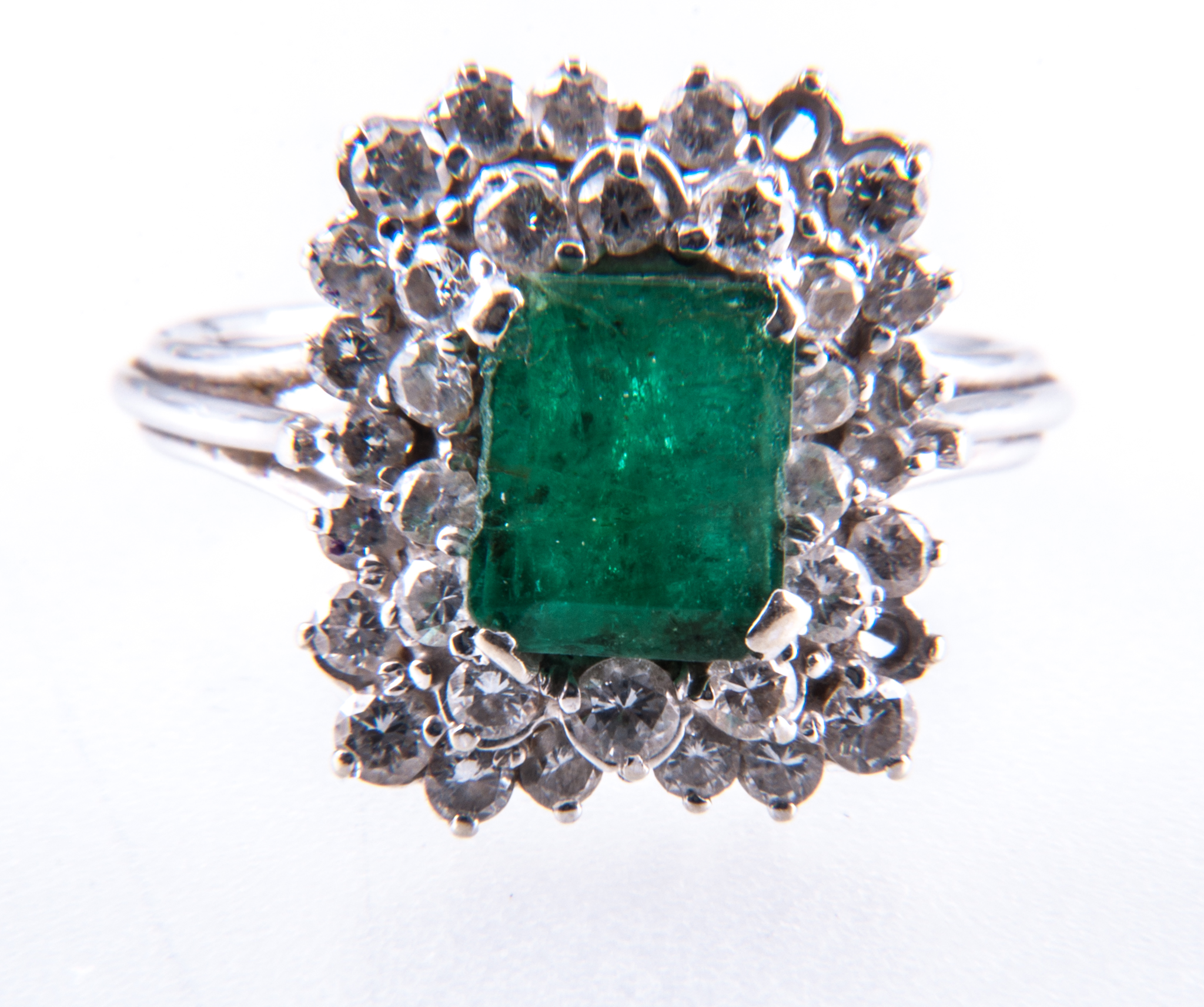 An emerald and diamond rectangular cluster ring,