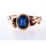 A yellow metal intaglio carved ring, the blue stone, 7mm x 5mm,