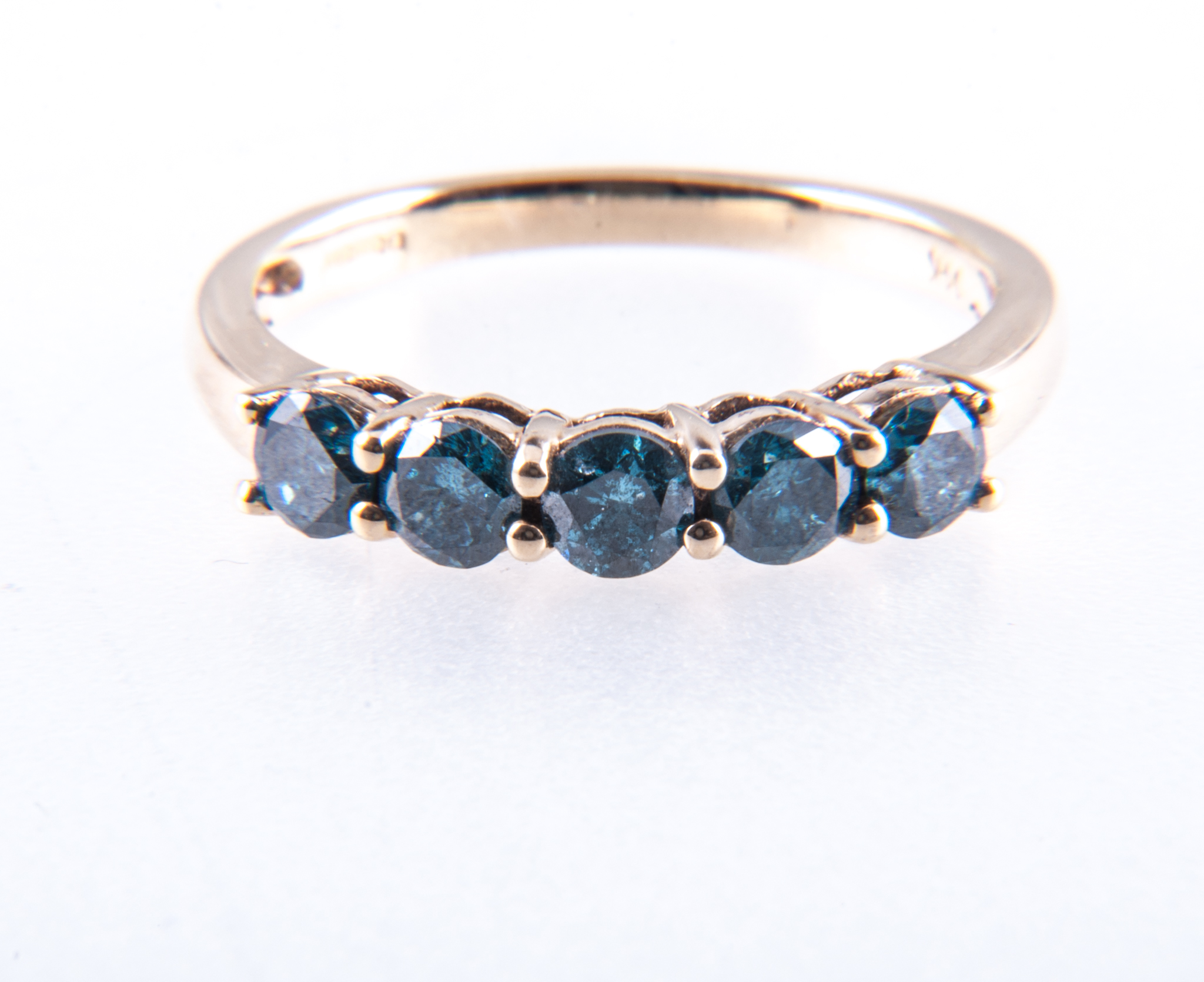 A teal diamond five stone half hoop ring, the deep turquoise brilliant cut stones,