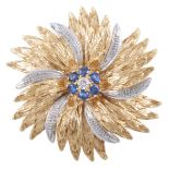 Cartier - A yellow and white metal circular floral brooch, 40mm diameter,