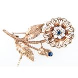 A sapphire and diamond floral brooch,