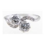 A diamond two stone crossover ring,