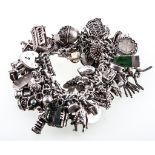 A silver charm bracelet and charms,