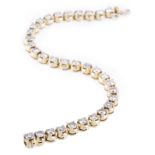 A 18 carat all yellow gold diamond set tennis design bracelet, thirty two diamonds,