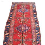 Persian pattern runner, red ground with four medallions, approx.
