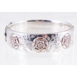 A silver half hinged bangle,