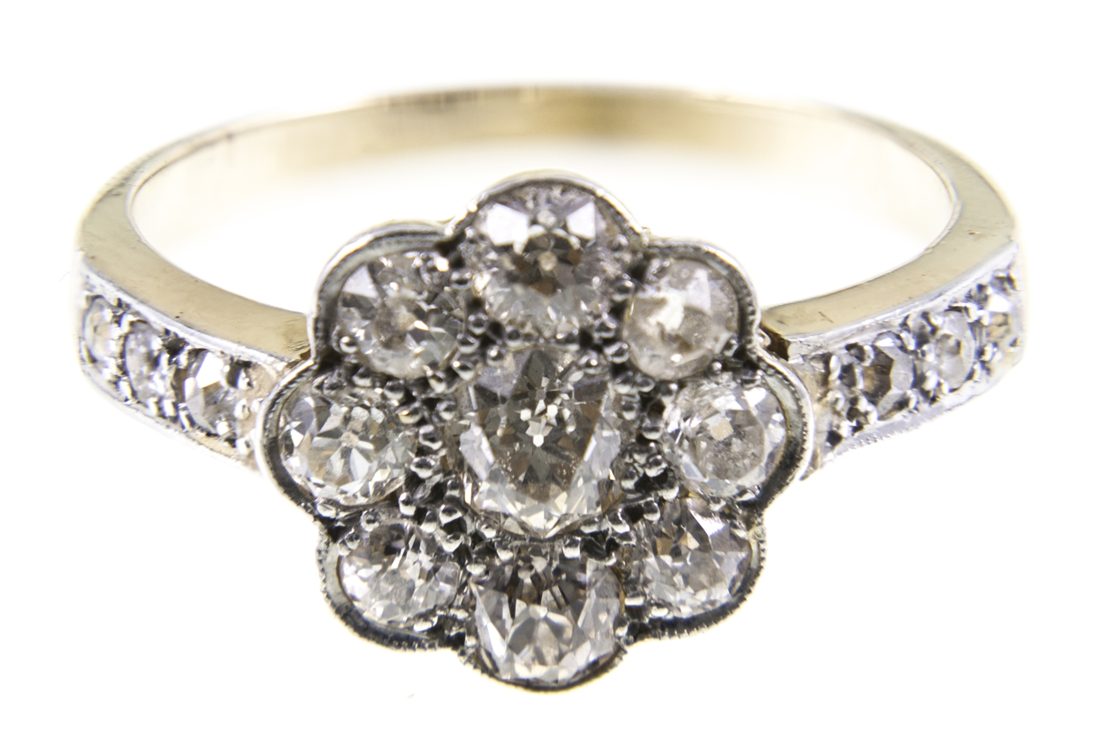 A diamond cluster ring, nine old brilliant cut diamonds,