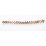 A 9 carat yellow gold bracelet, three rows of polished oval discs, overall width 15mm,