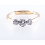 A diamond three stone ring, the brilliant cut stones, graduating in size,