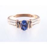 A tanzanite dress ring, one oval mixed cut tanzanite four claw set in an all yellow gold mount,