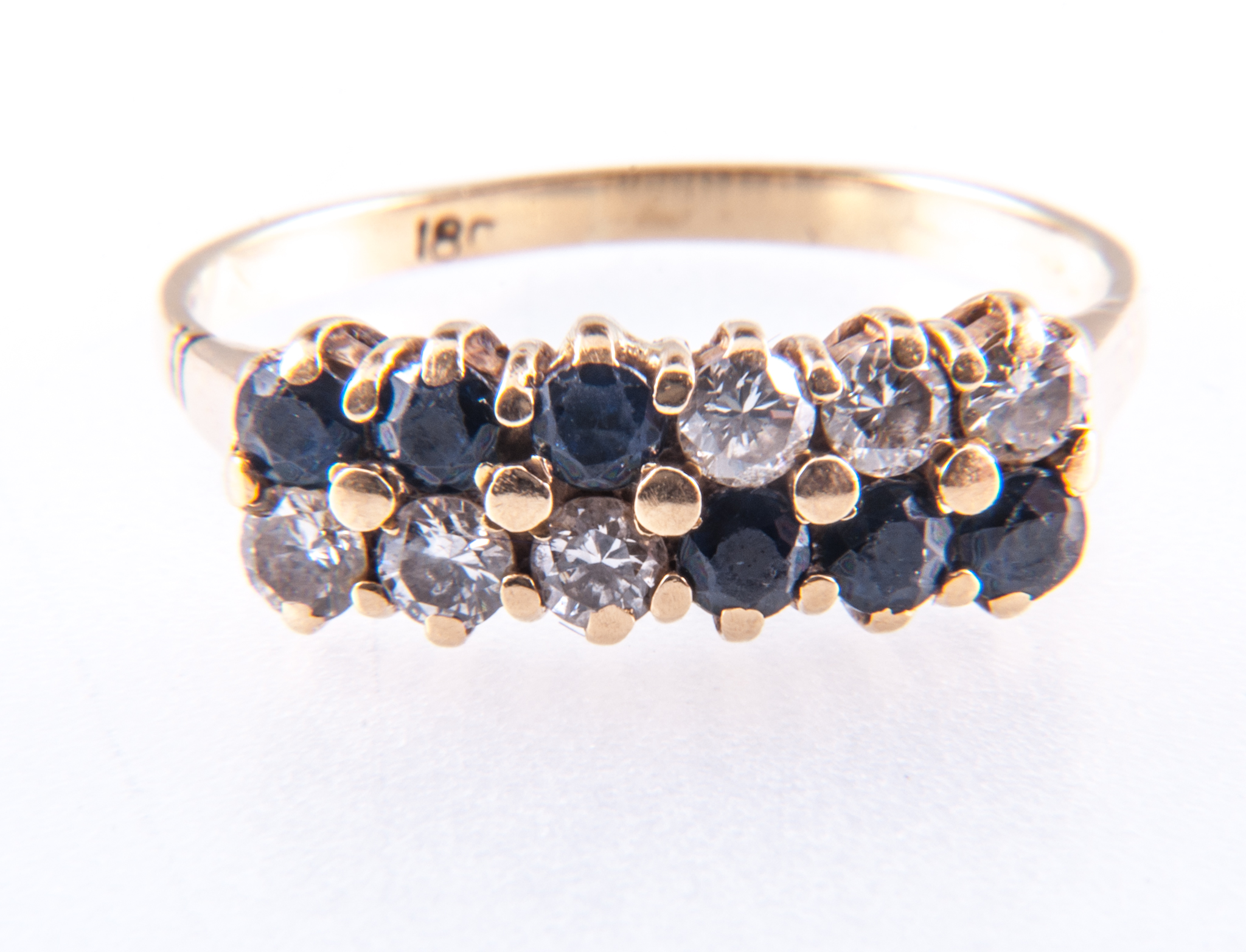 A sapphire and diamond ring, six diamonds, brilliant cut stones and six sapphires,