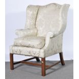 A Georgian style wing-back armchair.